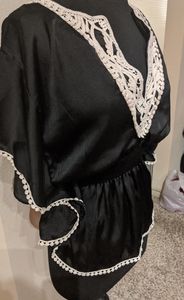 Black cinched waist peplum style blouse